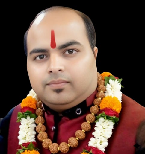 Shri Shri Amit Agarwal adorned with a traditional garland